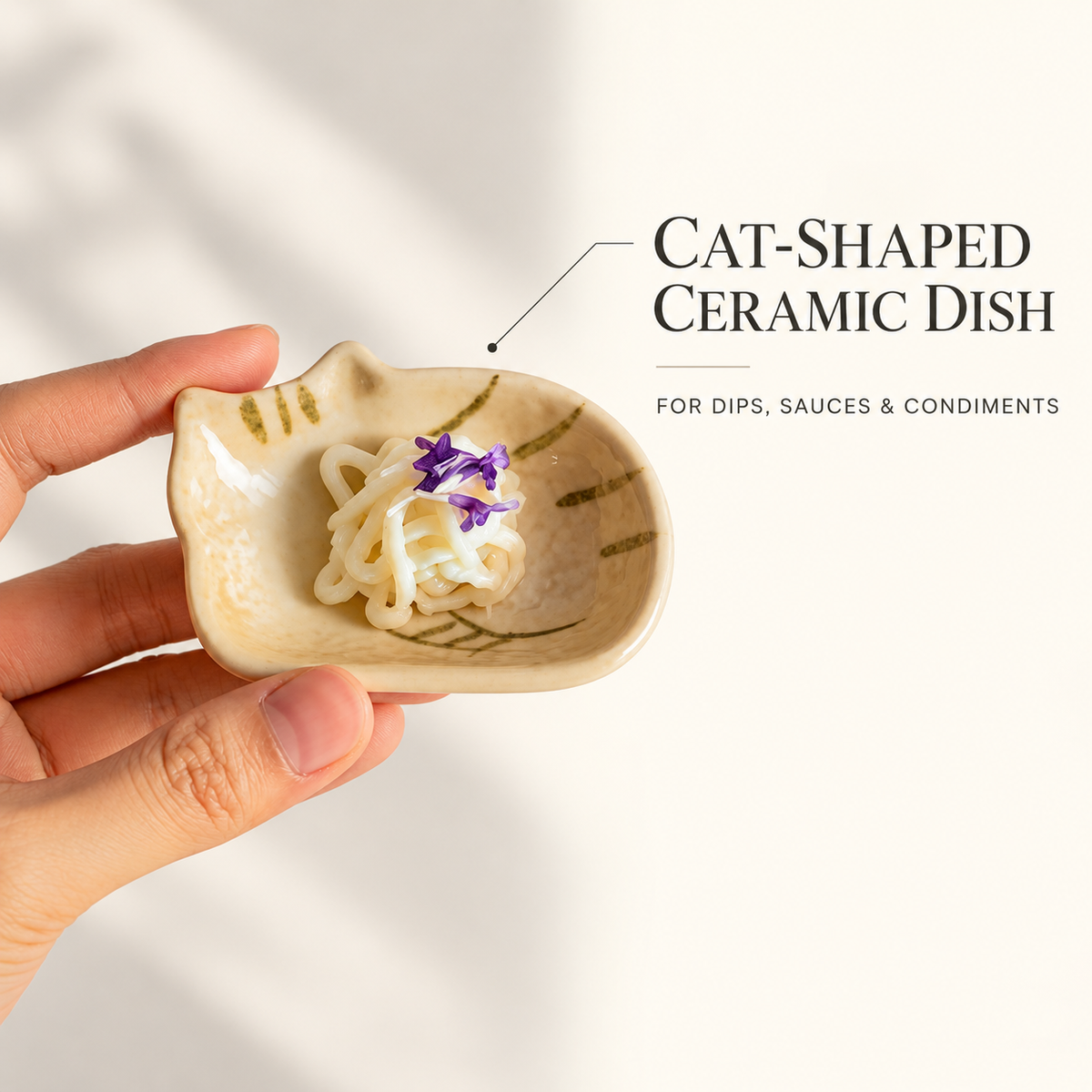 Cat-shaped ceramic dipping dish with English callouts for sauces, dips, and condiments.