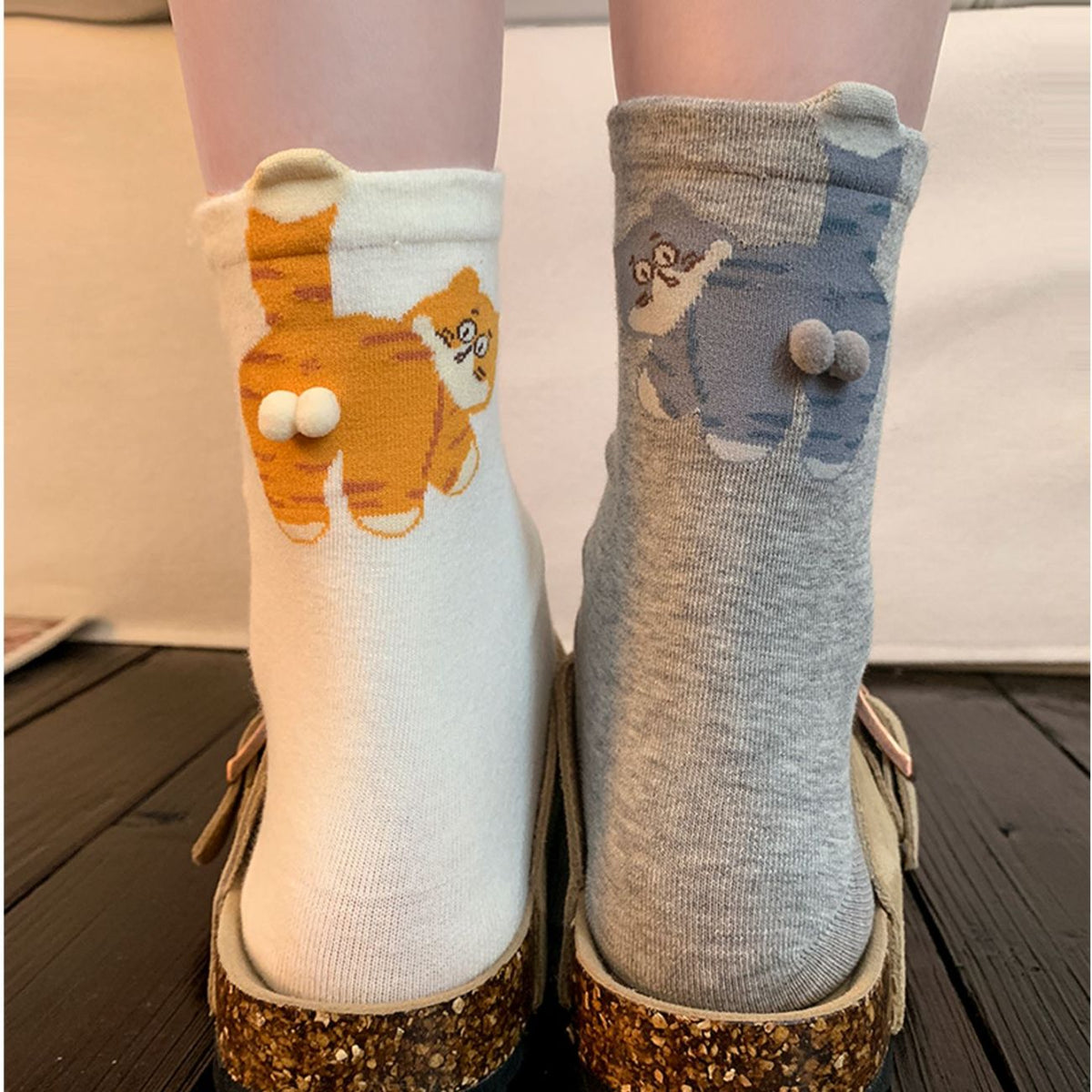 White and grey novelty cat crew socks with raised pom details