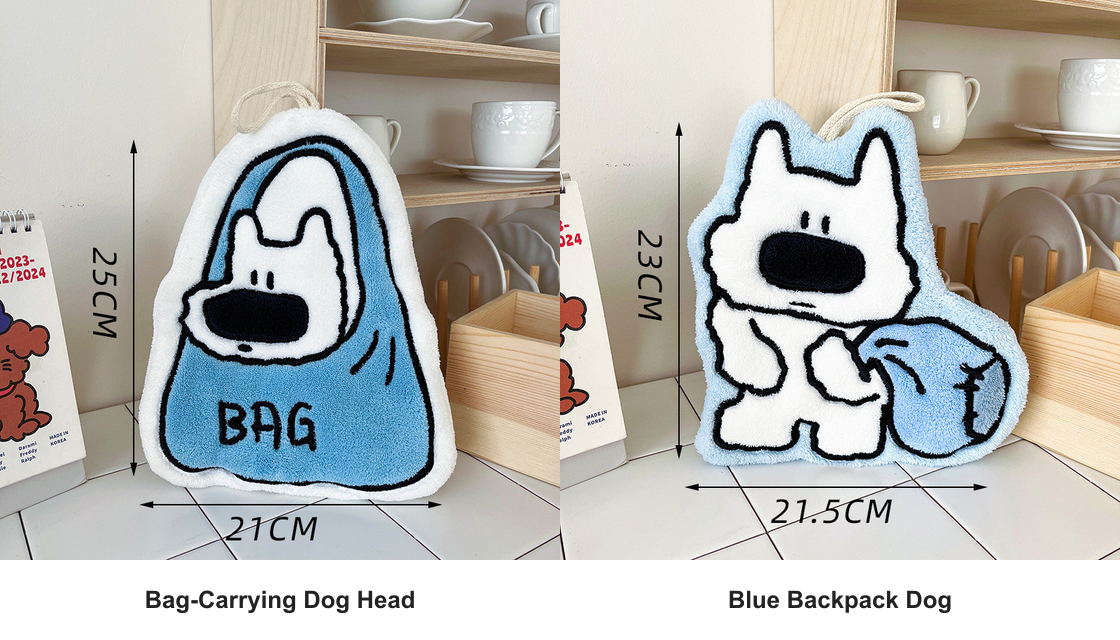 Two-piece set showing one Bag-Carrying Dog Head towel and one Blue Backpack Dog microfiber hanging hand towel