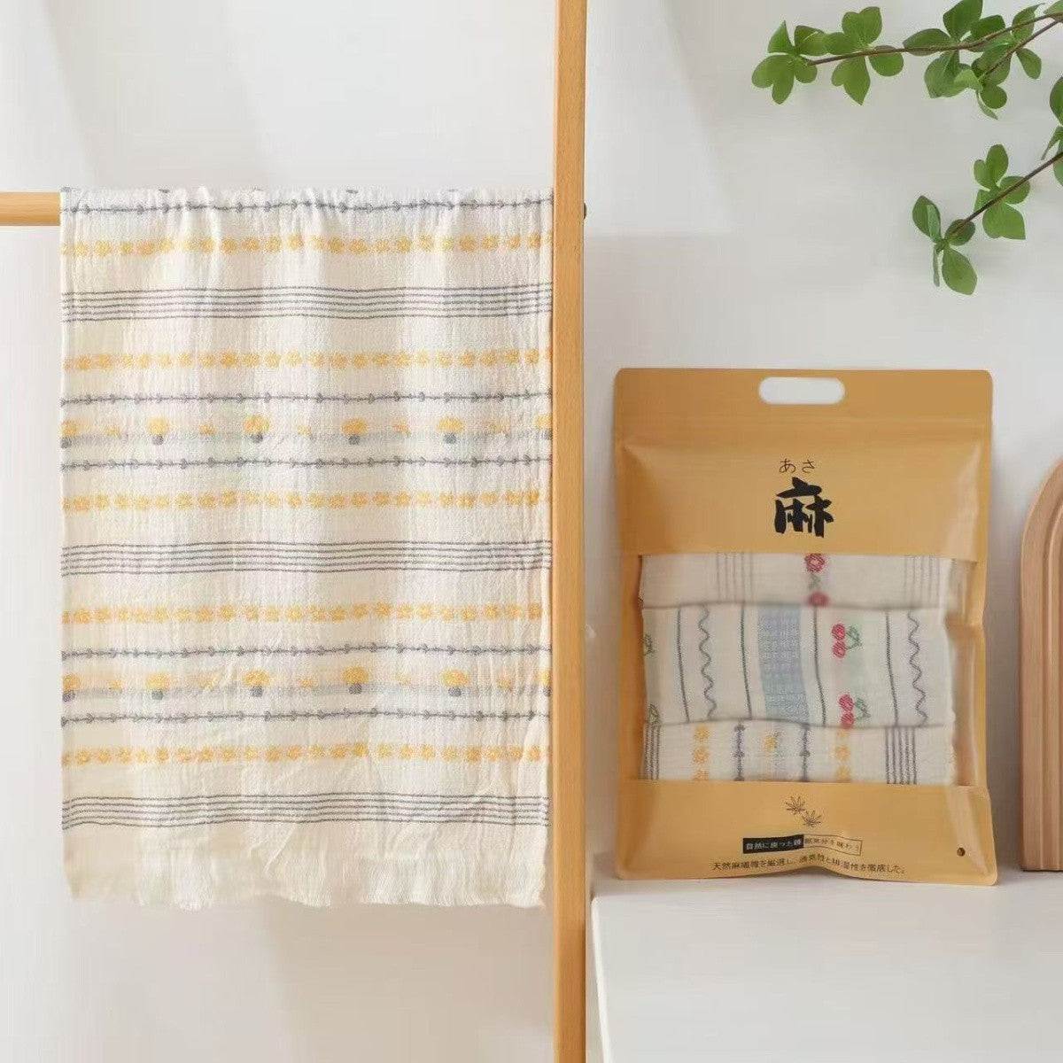 Striped gauze hand towel with small floral accents and matching packaged set
