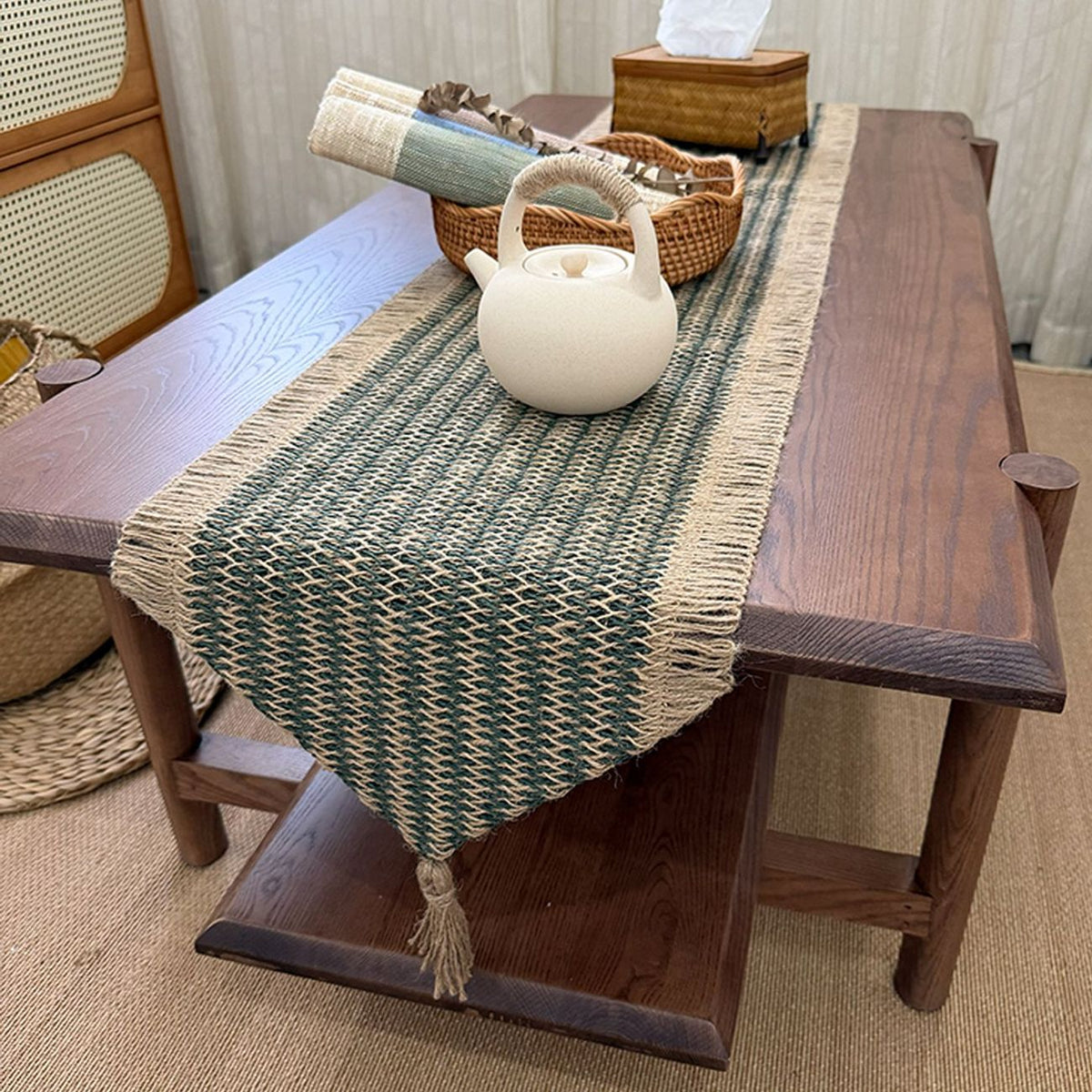 Forest green woven table runner styled on a dining table